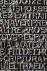 metallic ancient latin letters background texture (illegible inscriptions)