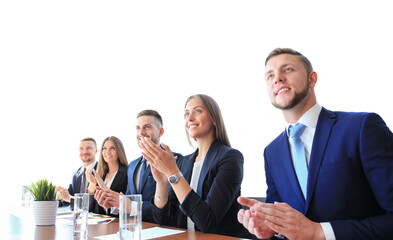 Photo of happy business people applauding at conference, focus on smiling girl on a transparent...