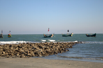 boats floating in the sea at Saint Martin Island; a beach in Bangladesh. In St. Martin many kinds of fishing boat's are available. The boat's are beautiful.