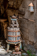An ancient wooden grape press in the ghost town of Celleno, Italy