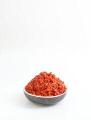 a bowl of chili sauce