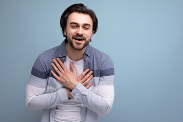 portrait of a well-groomed young brunette man on a studio background