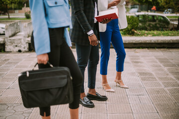 Close up of business coleagues standing