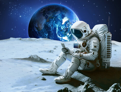 Astronaut sits on a Moon surface, holding phone in hands. AI generated image