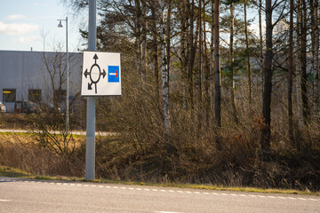 Sign showing a roundabout where one of the arrows point to a dead end.