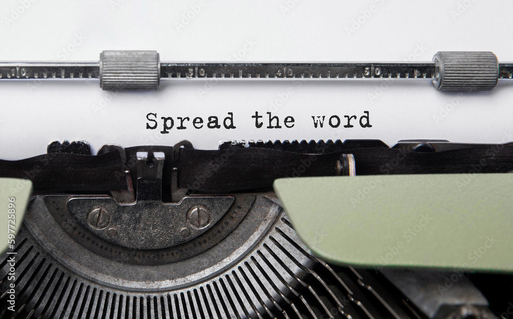 Poster text spread the word typed on retro typewriter