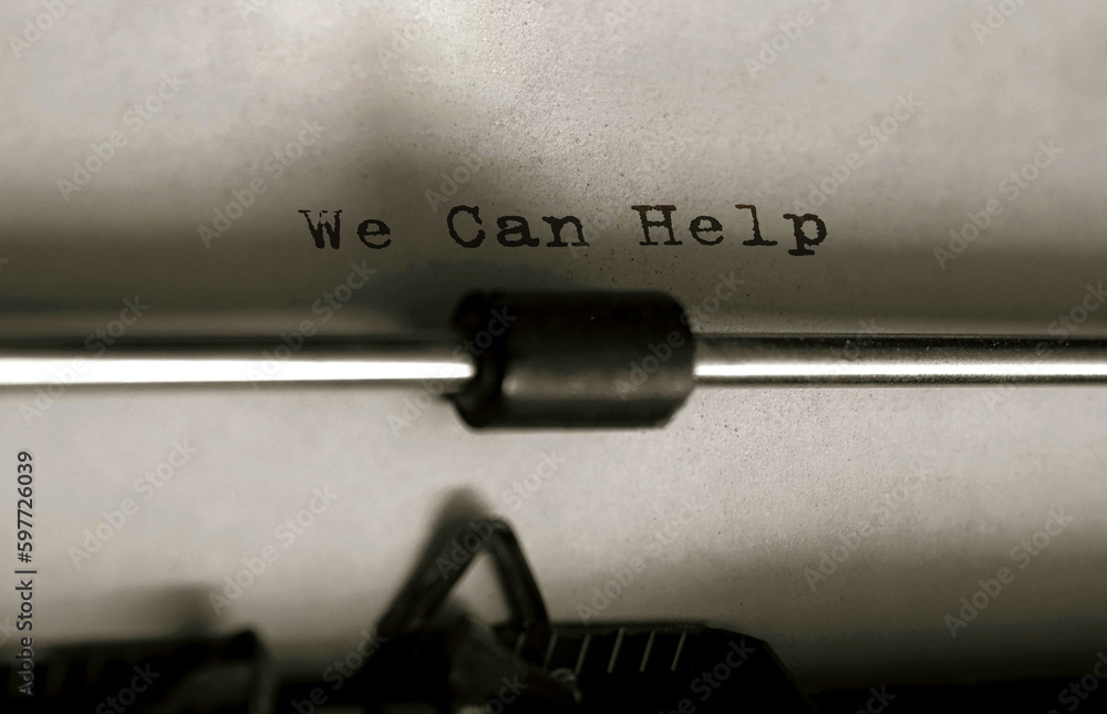 Poster text we can help typed on retro typewriter