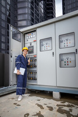 Electrical engineer working in control room. Electrical engineer man checking Power Distribution...