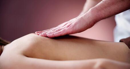 Naklejka premium Woman Receiving Back Massage From Therapist