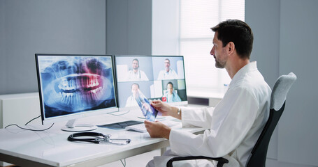 Fototapeta na wymiar Online Dentist Video Conference On Computer