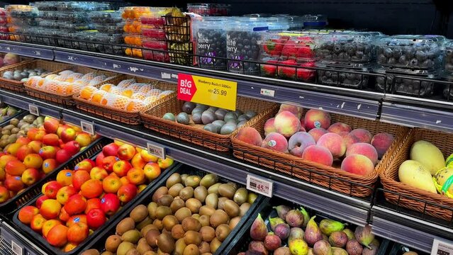 Fruits and vegetables on display in a supermarket. High quality 4k footage