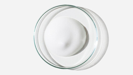 Foam, foam texture. Washing with foam. Foam in a Petri dish on a light background. Dab of cosmetic foam. Lab. - obrazy, fototapety, plakaty