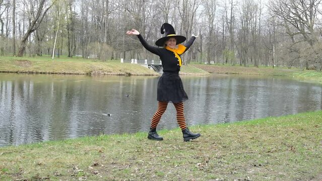 Dancing witch in orange stockings.