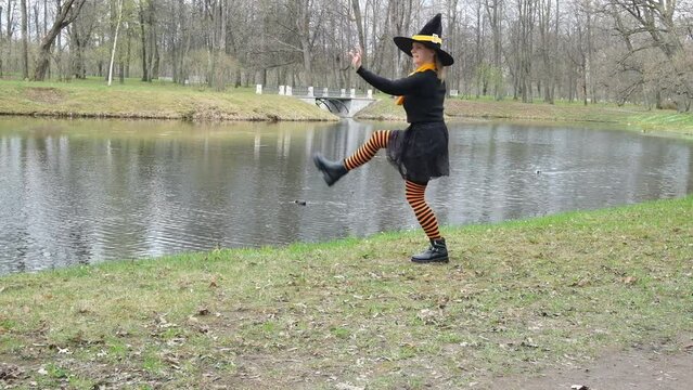 Dancing witch in orange stockings.