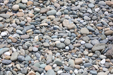 Stone pebbles as an abstract background. Texture.