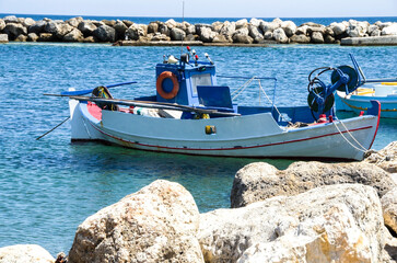 Tranquil scene os small fishing rboats in the harbor of Skyros island , Greece