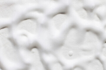  the texture of white foam over the entire background.