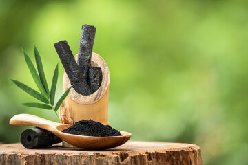 Bamboo charcoal and powder on nature background.