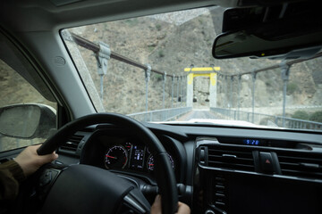 Driving car on high altitude drawbridge, China