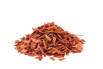 Pile of red Sandalwood chips (Pterocarpus santalinus), isolated on white background