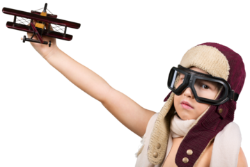 Happy kid playing with a toy airplane