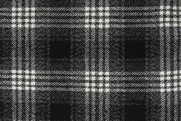Black and white texture of a plaid fabric from a factory fabric for clothes. checkered clothes...