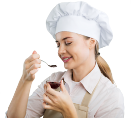 A beautiful young woman in chef hat is holding a spoon,
