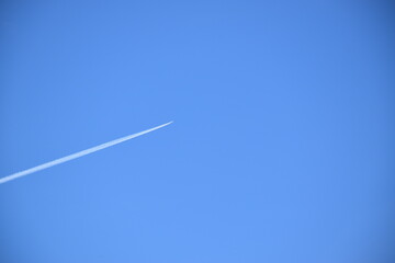 A plane in a blue sky, Sainte-Apolline, Québec, Canada