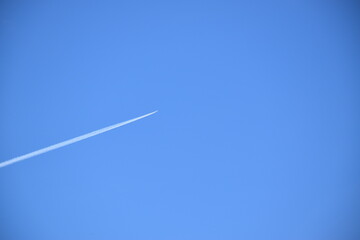 A plane in a blue sky, Sainte-Apolline, Québec, Canada