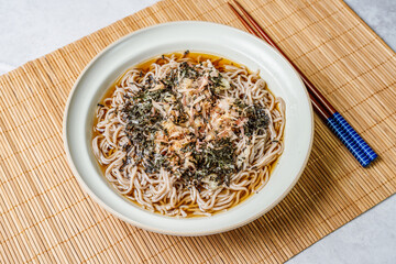 Korean food Naengmemilguksu, a winter delicacy, this buckwheat noodle dish is served in a cold chicken- or beef-based broth and topped with cold slices of beef and egg as a garnish.