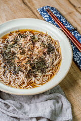 Korean food Naengmemilguksu, a winter delicacy, this buckwheat noodle dish is served in a cold chicken- or beef-based broth and topped with cold slices of beef and egg as a garnish.