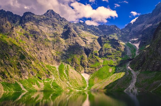 Beautiful lake in polish mountains in summer scenery.  Black Pond is one the most popular place in High Tatra Mountains, Poland.