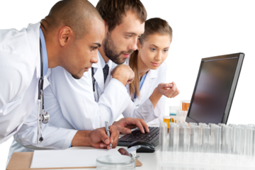 Portrait of Doctors Looking at Laptop and Writing on Clipboard