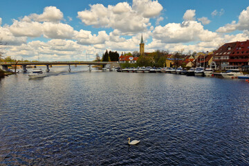 Fototapeta premium panoramic view of embankment in Mikolajki resort town, Warmia Masuria Province. Mikolajki, Poland