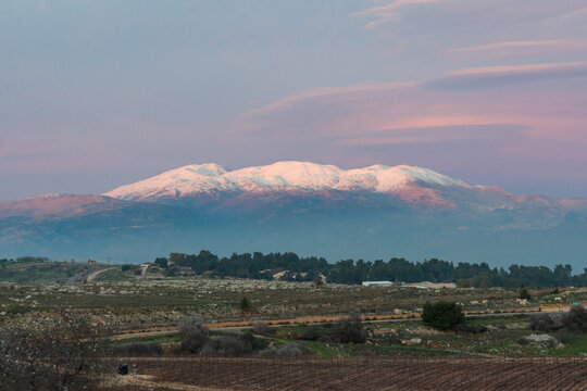 The snowy peak of Mount Hermon. A look from Galilee mountains