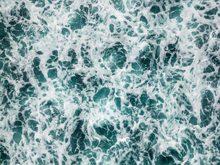 Airy view of an undulating, restless sea or ocean. Top view.