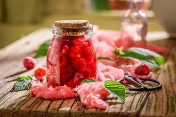 Sweet and tasty raspberry tincture with alcohol and raspberries