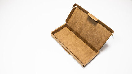Brown cardboard box isolated on white background. Clipping path included.