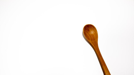 Wooden spoon isolated on white background. Clipping path included.