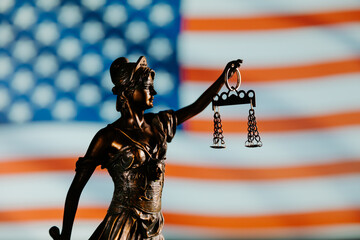Lady justice statue with USA flag. Law symbols