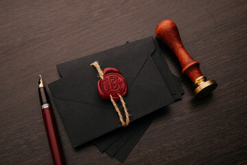 Envelope with notary public wax seal and stamp on table
