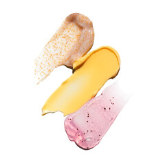 Swatches of yellow cream texture,, natural coffee scrub and pink salt scrub of cosmetics for face...