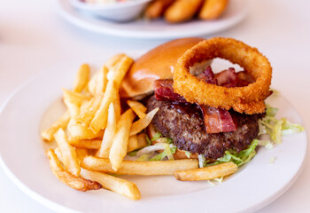 A burger on a plate in a diner