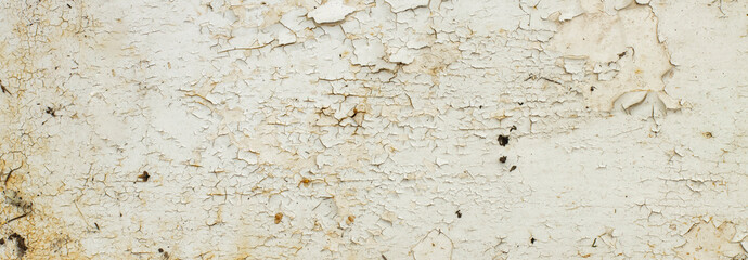 Wide view of the texture of an old painted metal surface with rust and cracks