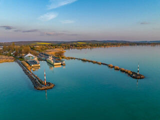 Naklejka premium Hungary - Ferry between Szántód and Tihany on Lake Balaton at sunset time from drone view