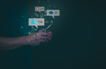 The concept of using digital media, technology, and social media. Surfing online, male hand using smartphone To play or use social media, remote work concept, work from home via the Internet