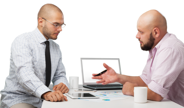 Team of serious businesspeople working on office desk