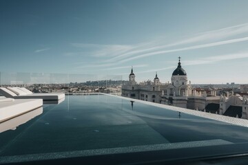 Naklejka premium Stunning rooftop pool with panoramic Madrid view. Generative AI