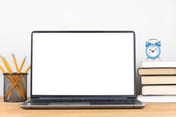 Modern workplace, laptop with blank transparent screen, stack of books, alarm clock and pencil pot on the desk