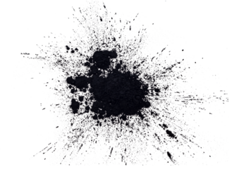 Black powder explosion isolated on white background, charcoal particles concept. Eye shadow. Graphite